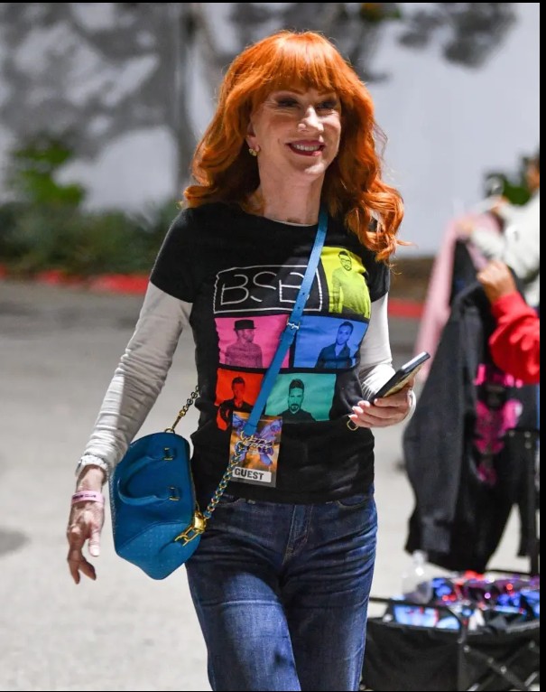 Kathy Griffin smiling on stage after confirming her third facelift.

